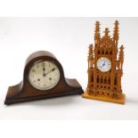 A wooden cased cathedral mantel clock, with pierced and arched tracery, the circular dial bearing Ro