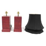 A pair of Chinese simulated red lacquer square section table lamps with shades, the lamp bases measu