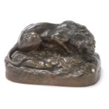 A 19thC cast bronze sculpture of a recumbent lion, on a naturalistic base, signed R Guillaume, 6cm h