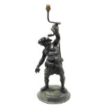 A late 19thC Continental bronze figural table lamp, modelled as Silenus, standing holding a serpent,