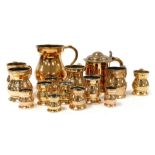 A group of 19thC brass beer flagons, measures, and a lidded tankard. (a quantity)