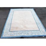 A blue and cream ground rug, 236cm x 300cm.
