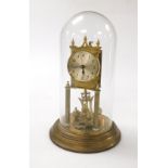 A German brass cased four hundred day anniversary clock, with silvered dial bearing Arabic numerals,