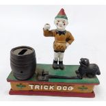 A cast iron Trick Dog money bank, 19cm wide.