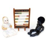 A vintage Chad Valley abacus, 39cm high, together with a Rosebud black composition doll, and a mid c