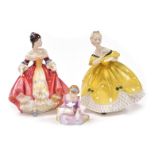 Three Royal Doulton porcelain figures, modelled as The Last Waltz, HN2315, Southern Belle, HN2229, a