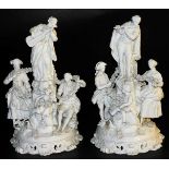 A pair of 19thC German white porcelain figure groups, of musicians, figures with garlands, etc., on