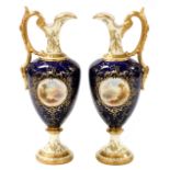 A pair of Coalport porcelain ewers, each decorated with a reserve depicting Loch Katrine and Loch Ga