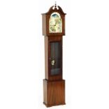 A mahogany cased long case clock, with a brass Roman numeric dial, moon phase dial with decorative s