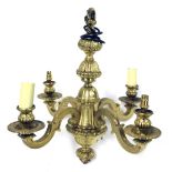 A heavy gilt four branch pendant light fitting, with stylised scroll branches and urn shaped sconces