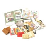 A The Post Boy stamp album and a collection of world stamps, predominantly 1920s and 30s world stamp