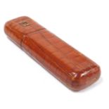 An early 20thC Dunhill crocodile skin cigar case, of oblong form, the lid opening to reveal two comp