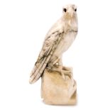A 19thC Continental carved alabaster figure of an eagle, perched on a stylised rock base, 16cm high.