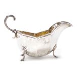 A George V silver sauce boat, of octagonal form raised on three hoof feet, Horace Woodward & Co Ltd