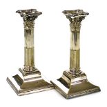 A pair of Victorian silver plated Corinthian column candlesticks, with loaded bases, 23cm high.