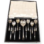 An early 20thC silver plated dessert service, comprising a large fruit and six smaller spoons, and s