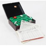 A 20thC Mah-jong game, contained in a lacquered box, together with instructions, scoring cards, etc.