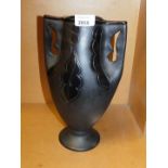 A mid 20thC modernist two handled pottery vase, the body of tapering form with shaped pierced handle