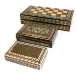 Three Middle Eastern inspired storage boxes, all with bone and mother of pearl inlaid design, includ
