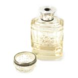 Two silver rimmed and cut glass dressing table items, comprising perfume bottle lacking stopper, wit