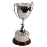 A Swatkins silver plated trophy, on a turned wooden base, 27cm high, boxed.