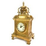 An Imperial brass cased mantel clock, circular enamel dial bearing Roman numerals, eight day movemen