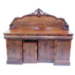 A Victorian flame mahogany sideboard, with carved cartouche splash back, three frieze cushion drawer