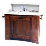 A Victorian style marble top sink, with a ceramic bowl, raised on an oak cabinet base, with single d