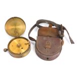 A circular brass clockwork military instrument, modelled as a pocket watch, number to inside 28744,