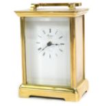 A Rapport of London brass cased carriage clock, with white enamel Roman numeric dial, and swing hand