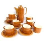 A Hornsea Saffron pattern part coffee service, comprising coffee pot, six cups and saucers, a sugar