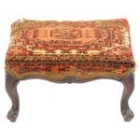 A Victorian heavy walnut stool, on short cabriole legs, 50cm x 40cm.