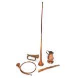 Copper wares, comprising a copper coaching horn, bugle, French horn, jug and a shoe horn. (5)