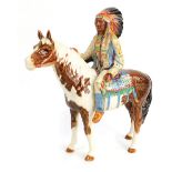 A Beswick pottery figure of a Native American Indian Chief on a skewbald horse, model no 1391, circu