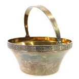 A Soviet era silver sweet meat dish, with a swing handle, and gilt interior, 916 standard, 5.86oz