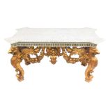 A centre table in the manner of William Kent, with white marbled top, over a gilt and painted frame