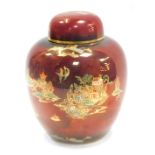 A Carltonware ginger jar and cover, chinoiserie decorated with a pagoda landscape against a rouge ro