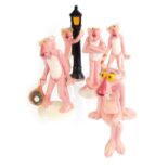 A group of four Japanese ceramic United Artists Pink Panther figures, two playing tennis, one standi