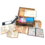 Philately. An album containing UK and World stamps, and a case of loose stamps and first day covers.