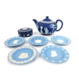 A group of Wedgwood blue Jasperware, comprising dark blue trinket box and teapot, and five Wedgwood