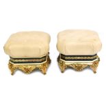 A pair of Vidal Grau gilt and ebonised stools, with buttoned leather seats, wooden and composition b