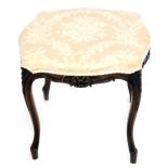 A Victorian walnut stool, with French cabriole legs and damask upholstery, 60cm diameter.
