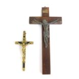 An oak crucifix, mounted with a silvered metal figure of Christ, etc, 21cm high, together with an eb