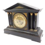 A late 19thC ebonised mantel clock, circular brass dial with chapter ring bearing Arabic numerals, J