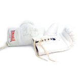 A pair of Lonsdale London boxing gloves, with biro signature Best Wishes Frank Bruno.