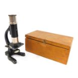 A student's cased microscope, in fitted wooden case, 16cm high.