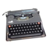 A Baby Deluxe cased vintage typewriter.