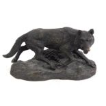 A bronze figure of a prowling fox, after Mene, 10cm high, 20cm wide.