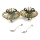 A cased pair of Victorian silver salts, of scallop shell form, comprising two salts and two spoons,