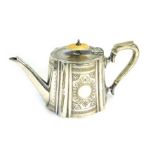 A Victorian silver plated teapot, of fluted tapering form, with engraved decoration, circular vacant